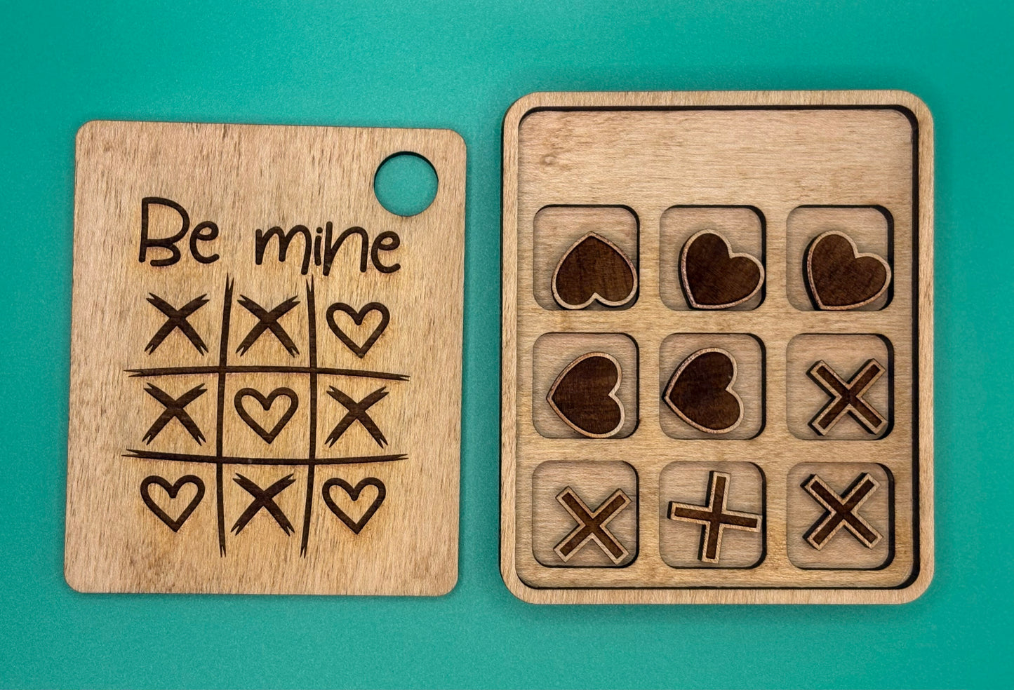 wooden board with tic-tac-toe patterns and heart designs 