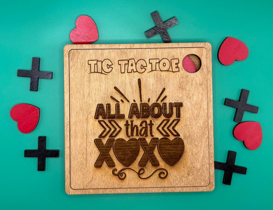 Wooden tic tac toe board with heart-themed design on a teal background