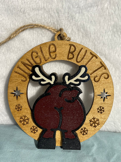 Wooden ornament with reindeer design and 'Jungle Butts' text on a textured background